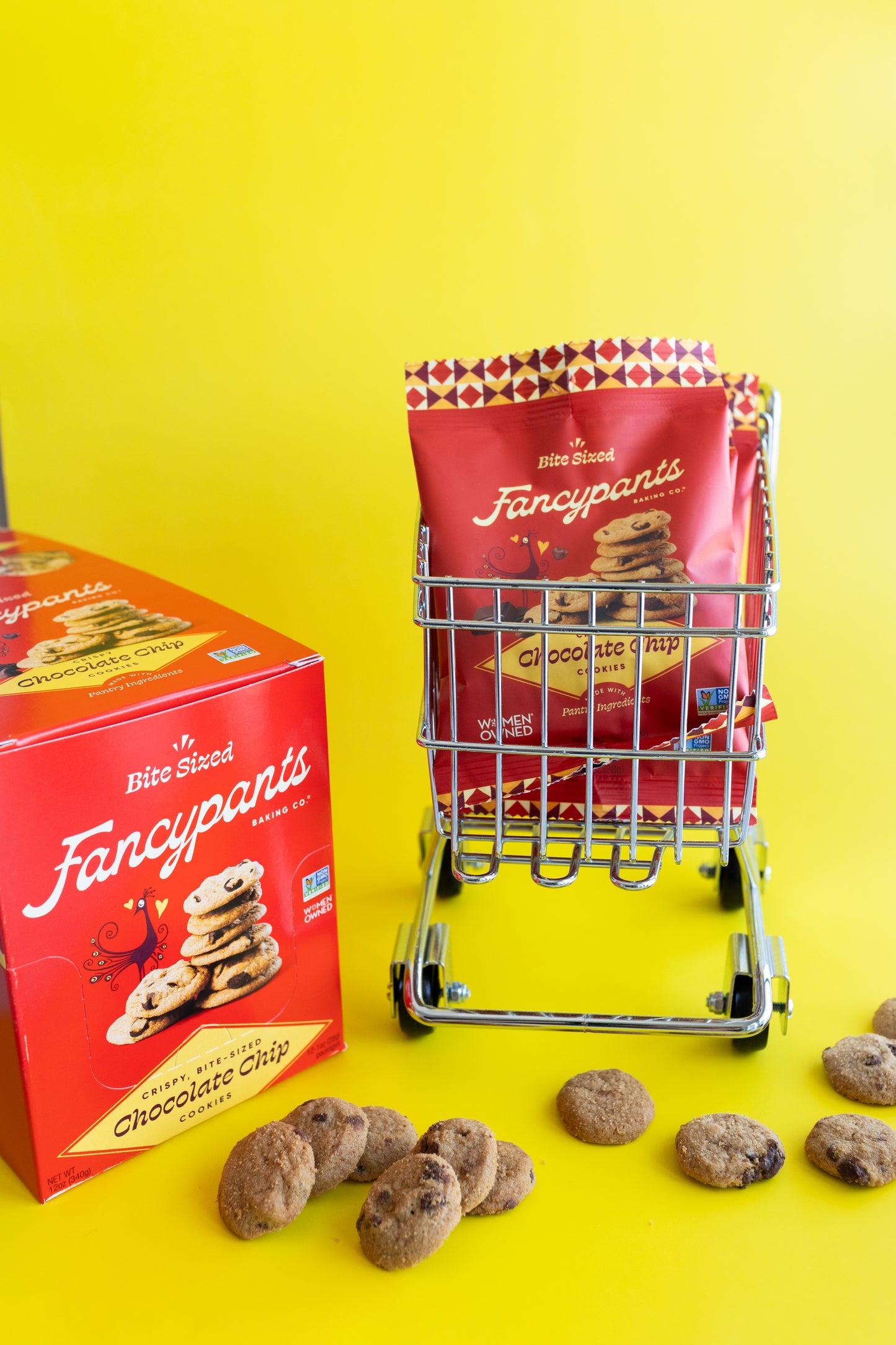 Fancypants cookies packaging with a mini shopping cart and cookies on a yellow background