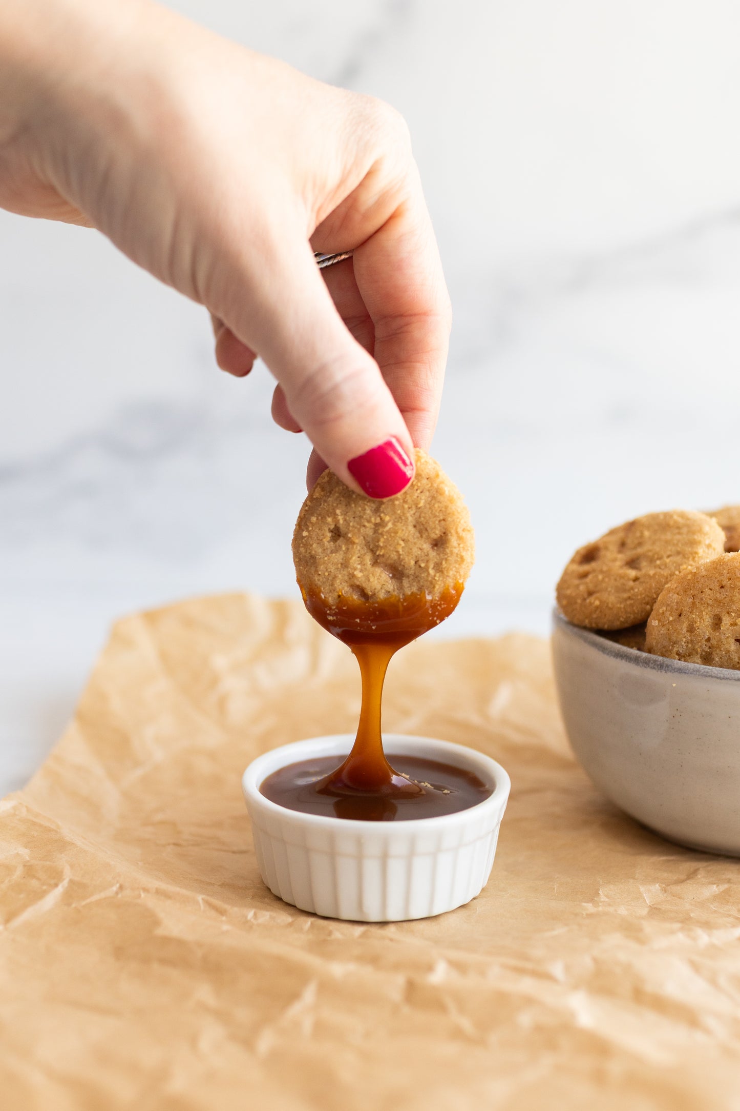 Fancypants crispy salted caramel cookie dipped in caramel sauce