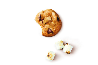 Thin crispy s’mores cookie with chocolate chips and toasted marshmallows